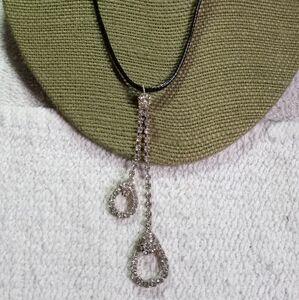 Long dangle rhinestone pendant on black cord necklace